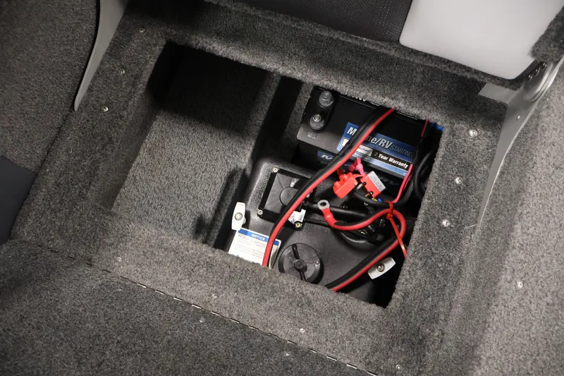 Slide: The Image of 2013 Lund 1750 Tyee boat battery compartment with wiring and marine battery. - 39