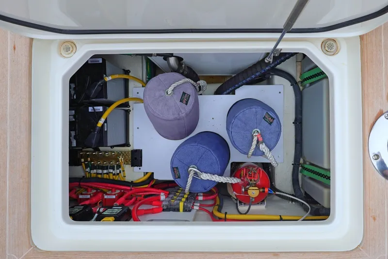 Slide: The Image of Electrical compartment of a 2022 Hinckley 35 boat, featuring wiring and components. - 21