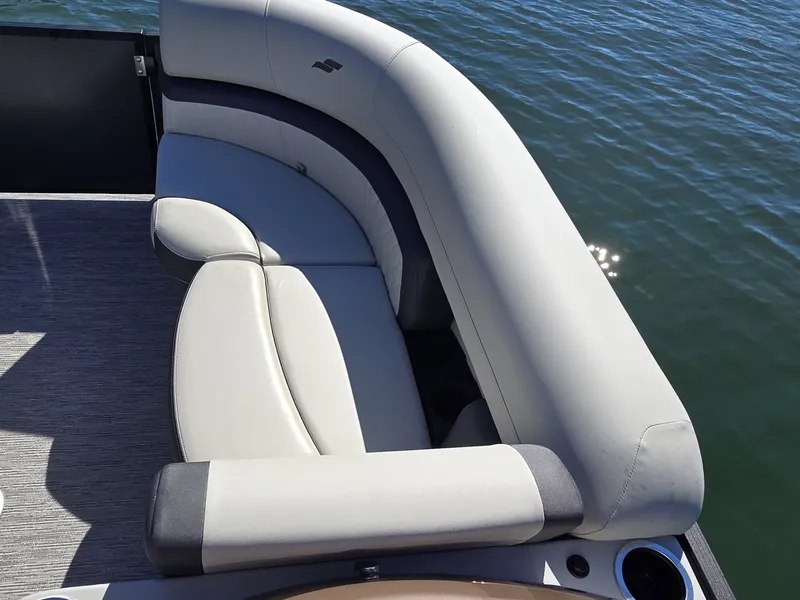 Slide: The Image of The image shows an elegant, curved seating area on a boat, surrounded by water. - 25