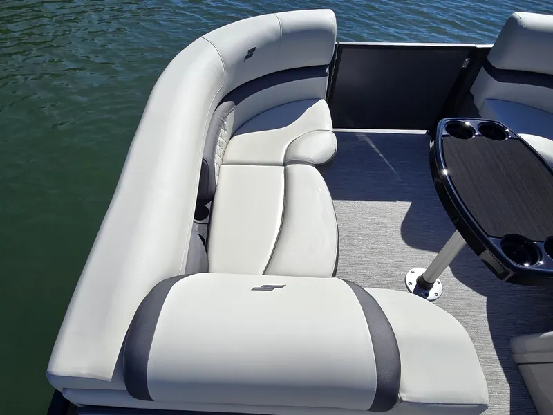 Slide: The Image of The image shows the sleek, cushioned seating area of a 2027 Starcraft EX 20 Q DH boat. - 23
