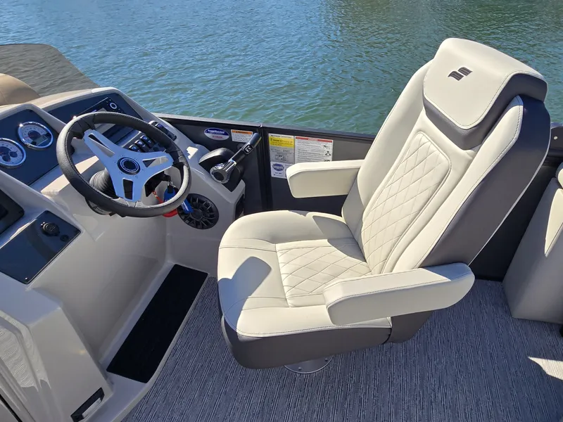 Slide: The Image of Starcraft EX 20 Q DH 2027: Luxurious captain's chair with elegant stitching, surrounded by water. - 19