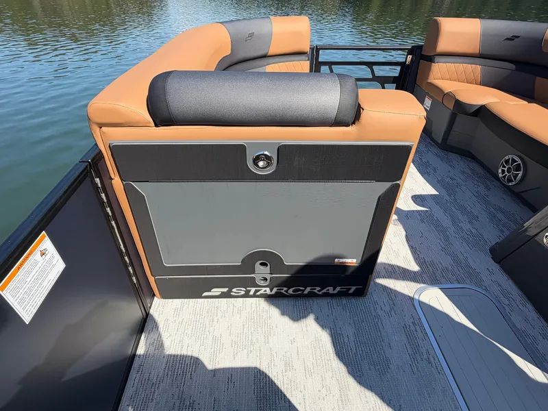 Slide: The Image of The image shows the interior of a 2027 Starcraft EXS 3 DL boat with beige and gray seating. - 20