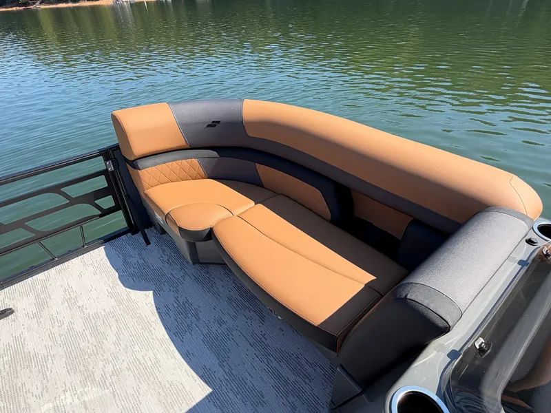 Slide: The Image of The image shows a luxurious seating area on a boat, surrounded by calm water. - 28