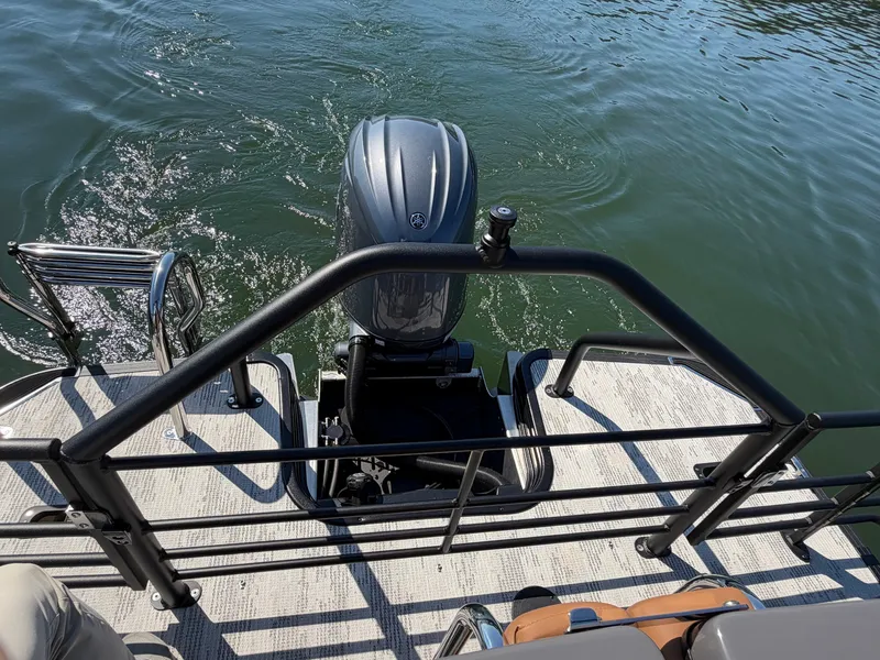 Slide: The Image of The image shows the stern of a 2027 Starcraft EXS 3 DL with an outboard motor. - 8