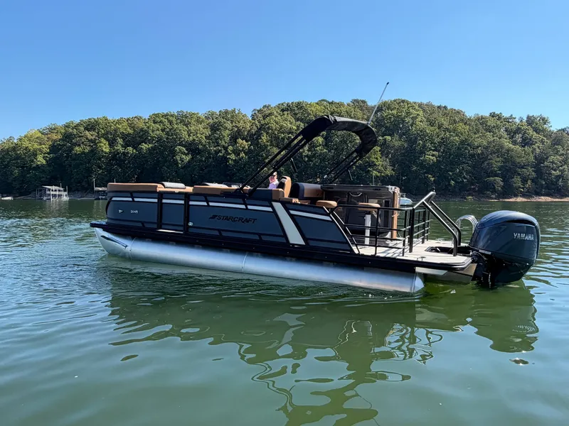 Slide: The Image of A 2027 Starcraft EXS 3 DL pontoon boat on a calm lake. - 40