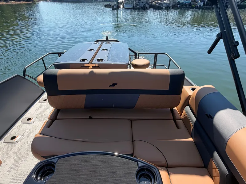 Slide: The Image of The image shows the rear of a 2027 Starcraft EXS 3 DL boat with beige seating. - 32