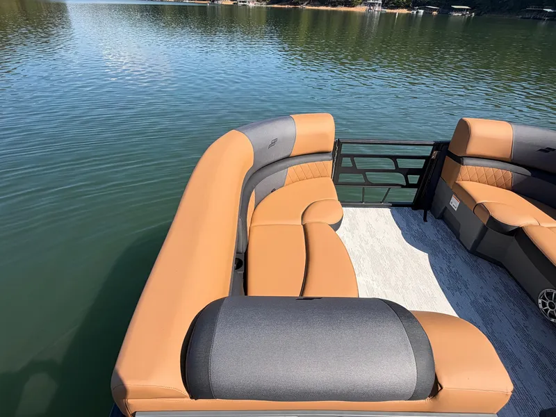 Slide: The Image of The image shows the deck of a 2027 Starcraft EXS 3 DL with beige and gray seating. - 27