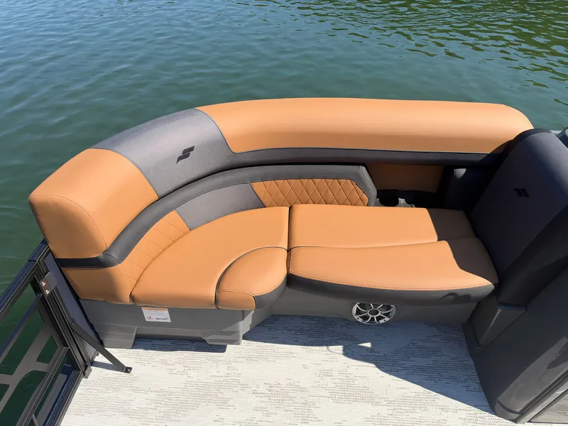 Slide: The Image of Starcraft EXS 3 DL 2027 with sleek, cushioned seating in orange and gray on a pontoon boat. - 30