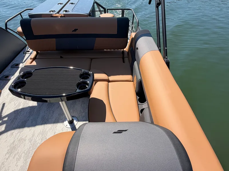 Slide: The Image of The image shows the interior of a 2027 Starcraft EXS 3 DL boat with beige and gray seating. - 17
