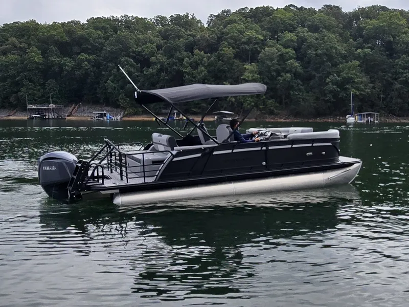 Slide: The Image of Starcraft EXS 3 Q DH 2027 on calm water with a wooded shoreline in the background. - 37