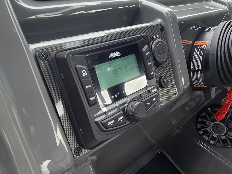 Slide: The Image of Close-up of a modern boat control panel with a digital display and controls. - 17