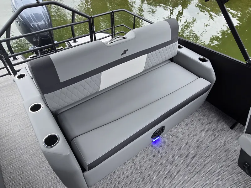 Slide: The Image of The 2027 Starcraft EXS 3 Q DH features a gray bench seat with cup holders and modern design. - 13