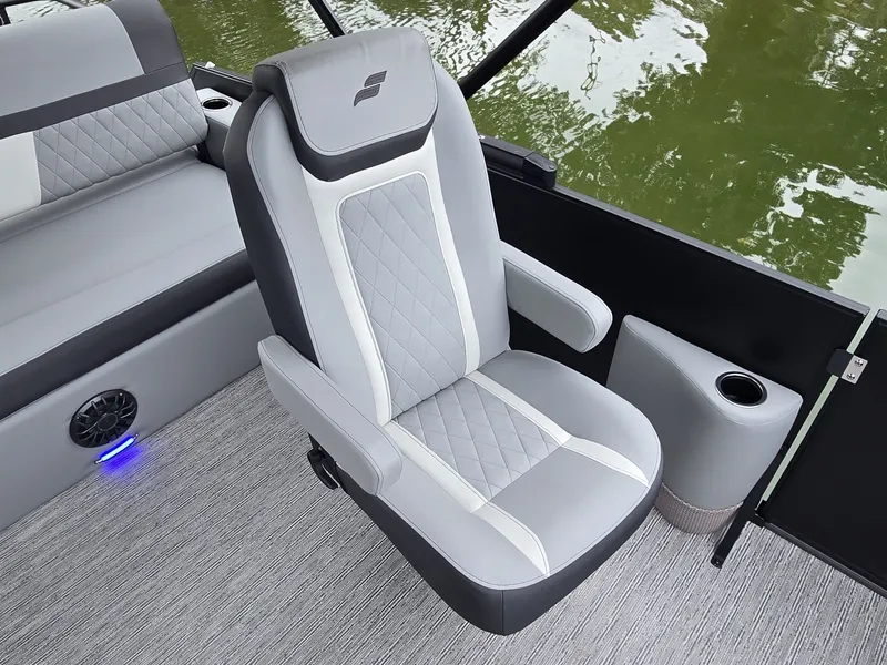 Slide: The Image of Modern boat seat with gray and white upholstery, surrounded by green water. - 19