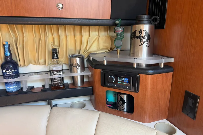 Slide: The Image of Interior of 2004 Chaparral Signature 310 with bar setup and audio system. - 14