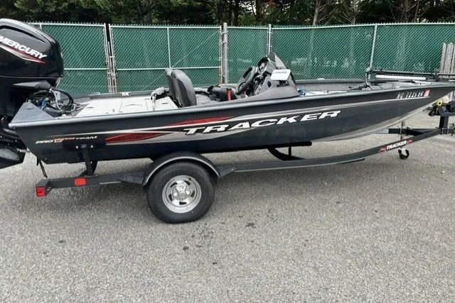 The Image of 2021 Tracker Pro Team 175 TF boat on trailer, parked outdoors. - 1