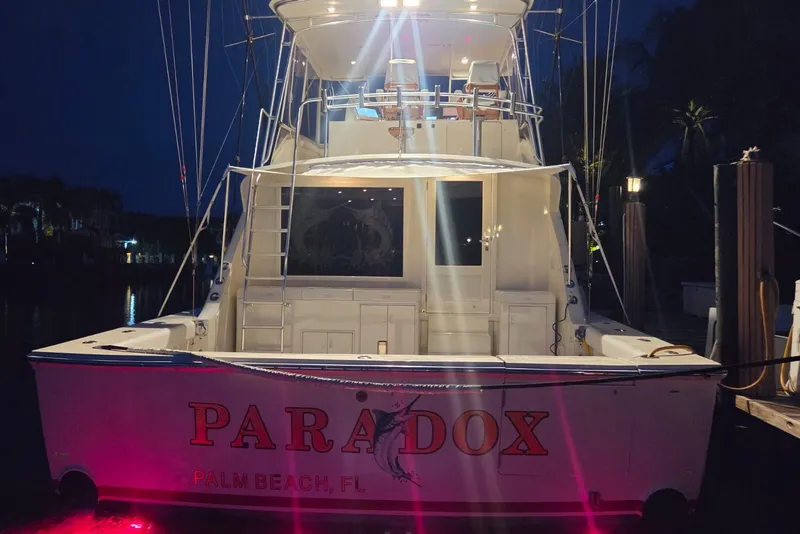Slide: The Image of 1984 Bertram 54 Convertible yacht docked at night in Palm Beach, FL. - 83