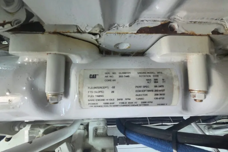 Slide: The Image of Engine label on a 1984 Bertram 54 Convertible, displaying technical specifications. - 126