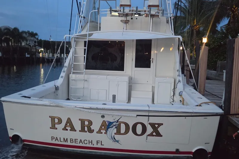 Slide: The Image of 1984 Bertram 54 Convertible yacht docked in Palm Beach, Florida at dusk. - 85