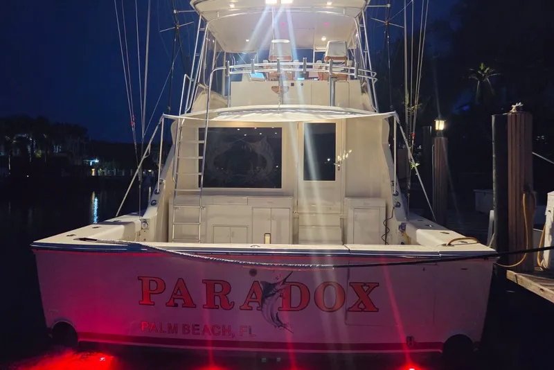 Slide: The Image of 1984 Bertram 54 Convertible yacht "Paradox" docked at night in Palm Beach, FL. - 77