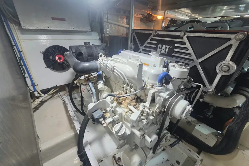 Slide: The Image of Engine room of a 1984 Bertram 54 Convertible with CAT machinery. - 124