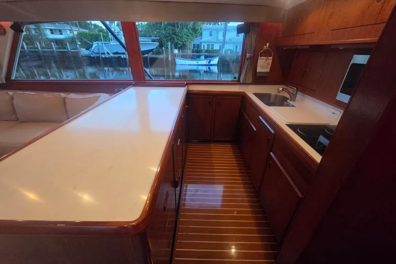Slide: The Image of Interior of 1984 Bertram 54 Convertible yacht with modern kitchen and large windows. - 37