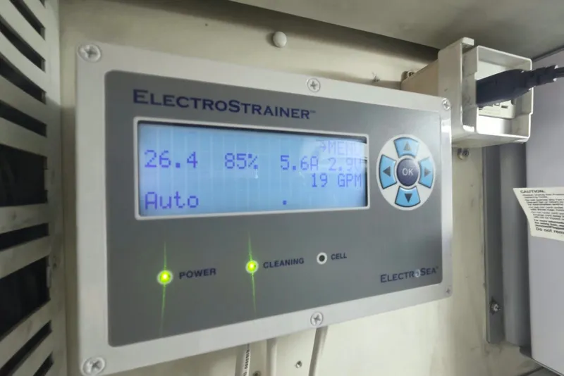 Slide: The Image of ElectroStrainer control panel on a 1984 Bertram 54 Convertible yacht, displaying operational data. - 120
