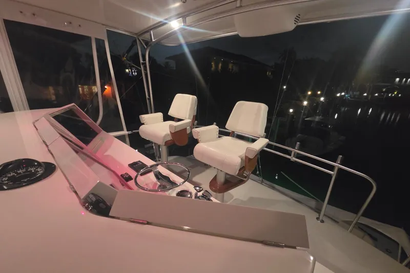 Slide: The Image of Interior view of 1984 Bertram 54 Convertible yacht cockpit at night. - 62