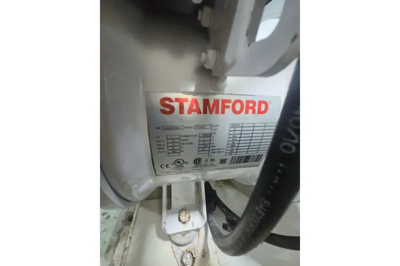 Slide: The Image of Stamford generator label on a 1984 Bertram 54 Convertible boat engine. - 121