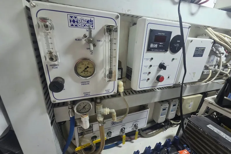 Slide: The Image of Control panel of a 1984 Bertram 54 Convertible yacht, featuring Watermaker system. - 125