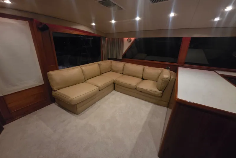 Slide: The Image of Interior of 1984 Bertram 54 Convertible yacht with beige L-shaped sofa. - 89