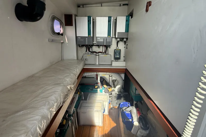 Slide: The Image of Interior of 2021 Elling E6 yacht, featuring equipment and storage area. - 101