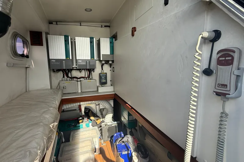 Slide: The Image of Interior of 2021 Elling E6 yacht showing electrical equipment and storage area. - 102