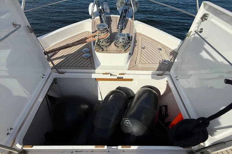 Slide: The Image of Open storage compartment on 2021 Elling E6 yacht with ropes and equipment. - 107