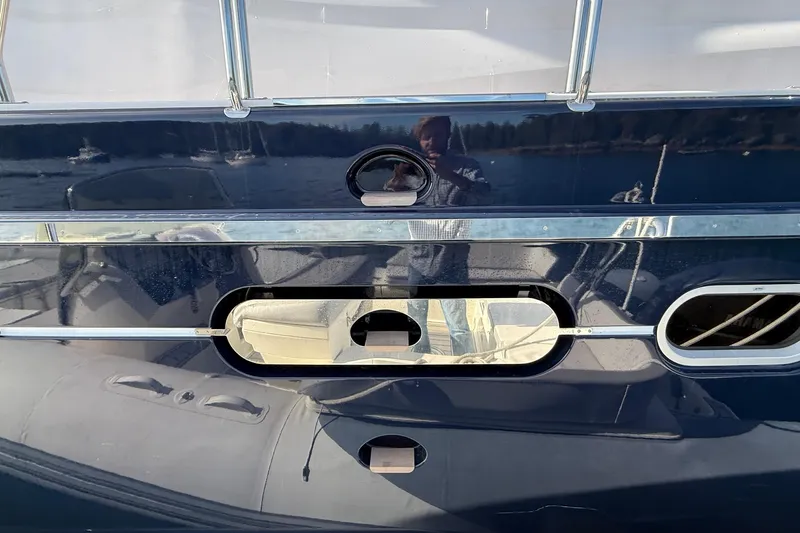 Slide: The Image of 2021 Elling E6 yacht exterior with reflective surface and chrome accents. - 83