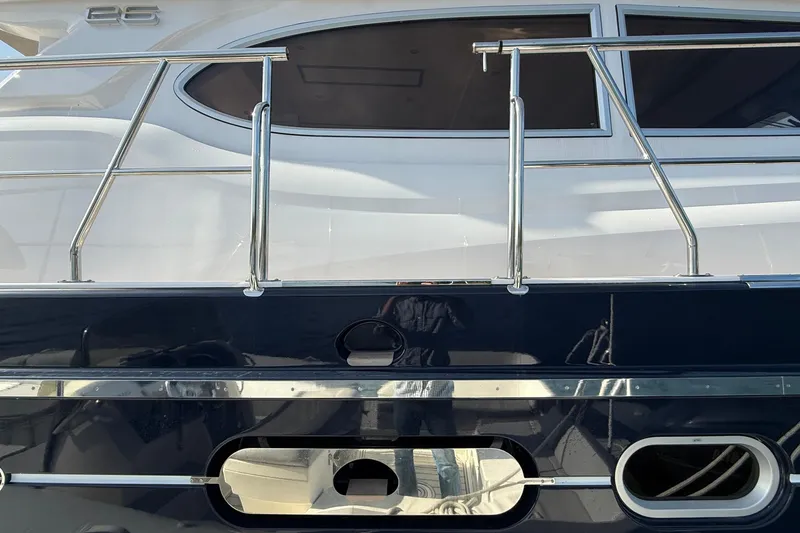 Slide: The Image of 2021 Elling E6 yacht exterior with sleek design and polished railings. - 84