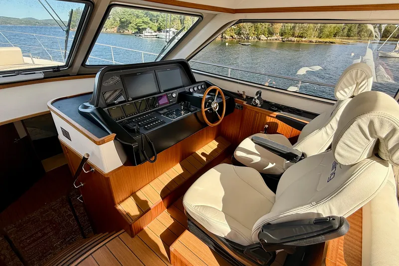 Slide: The Image of Luxurious 2021 Elling E6 yacht interior with modern helm and plush seating. - 26
