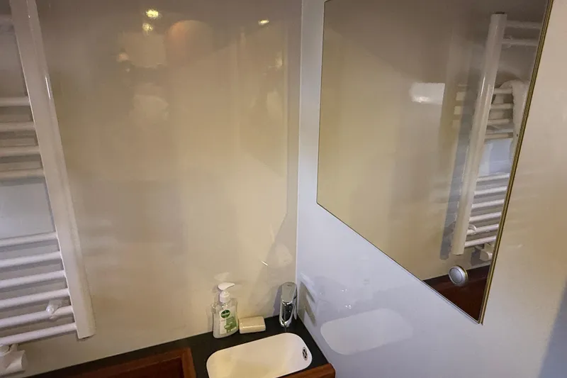 Slide: The Image of Bathroom interior of 2021 Elling E6 yacht with mirror and sink. - 39
