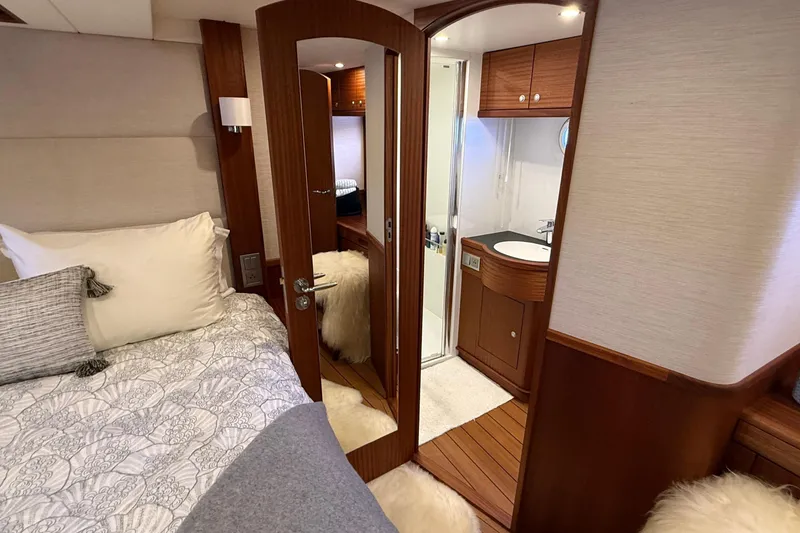Slide: The Image of Luxurious 2021 Elling E6 yacht bedroom with ensuite bathroom and elegant wood finishes. - 63