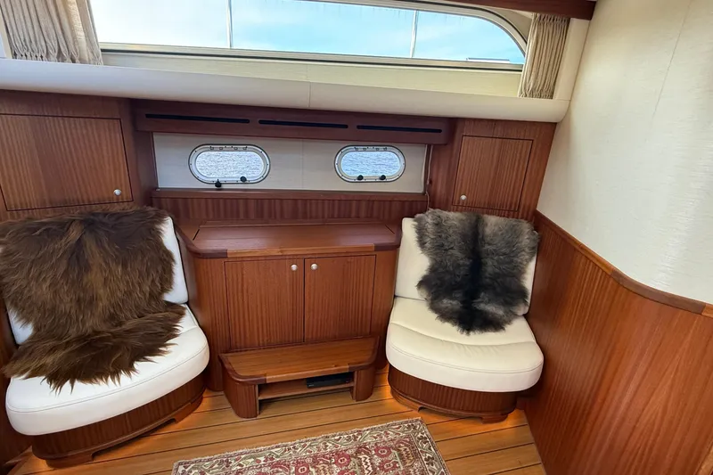 Slide: The Image of Luxurious interior of 2021 Elling E6 yacht with plush seating and wooden accents. - 33