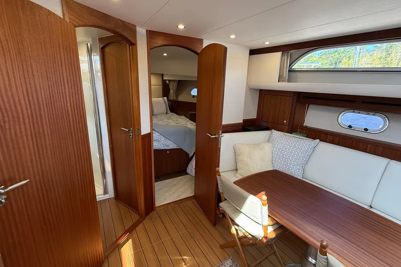 Slide: The Image of Luxurious interior of 2021 Elling E6 yacht with wood finish and cozy seating area. - 75