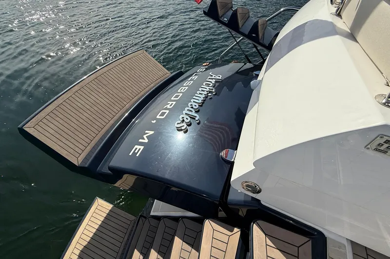 Slide: The Image of Elling E6 2021 yacht with wooden deck, docked on calm water. - 92