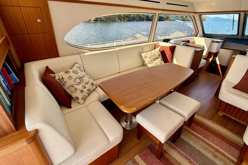 Slide: The Image of Luxurious 2021 Elling E6 yacht interior with elegant seating and scenic water view. - 18
