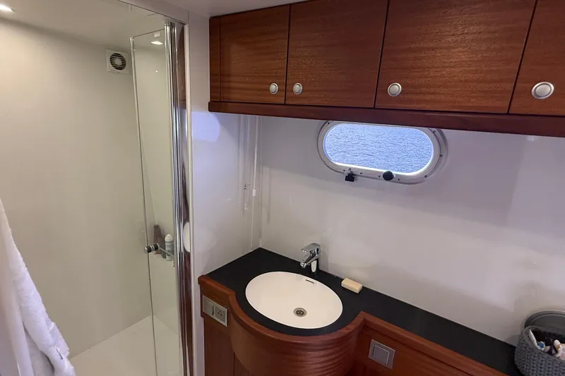 Slide: The Image of Luxurious bathroom in 2021 Elling E6 yacht with modern shower and wooden cabinetry. - 64