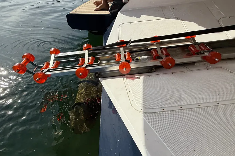 Slide: The Image of Boat boarding ladder with orange rollers on a 2021 Elling E6 yacht. - 94