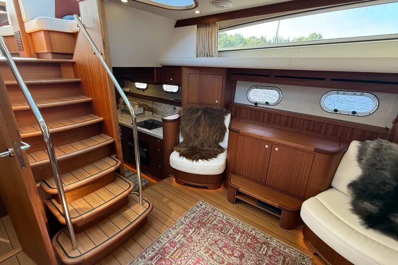 Slide: The Image of Luxurious interior of 2021 Elling E6 yacht with wooden finishes and plush seating. - 32