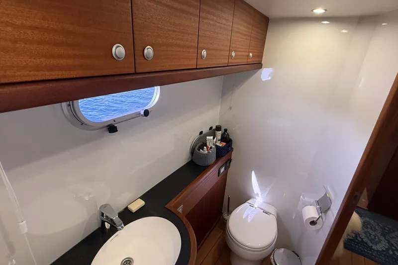 Slide: The Image of Luxurious bathroom in 2021 Elling E6 yacht with wooden cabinets and ocean view. - 68