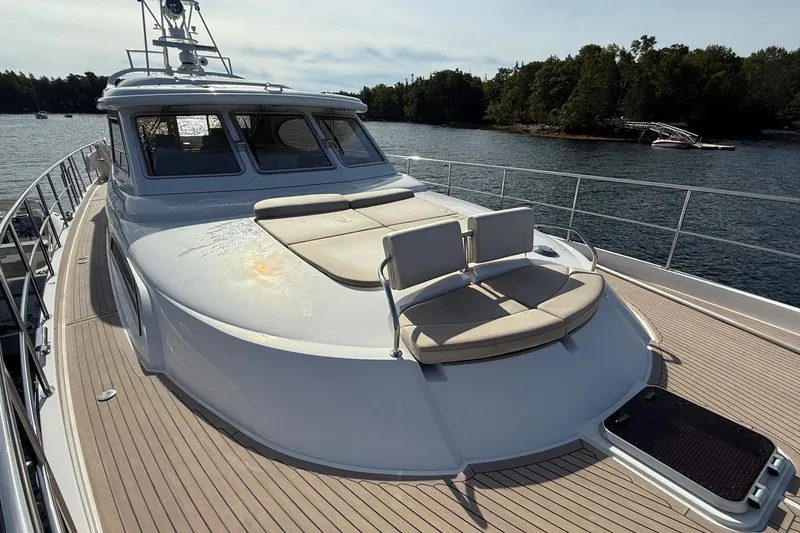 Slide: The Image of Luxury Elling E6 yacht, 2021 model, with spacious deck and sunbathing area on calm waters. - 104