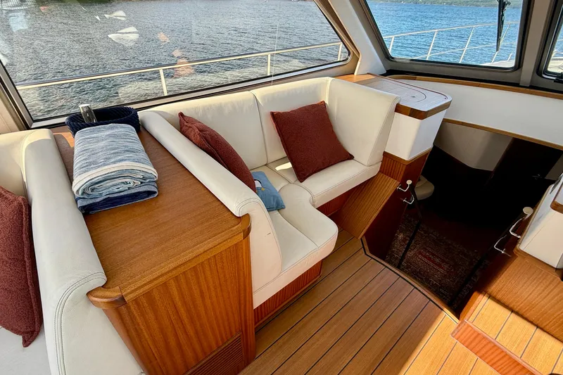 Slide: The Image of Luxurious interior of 2021 Elling E6 yacht with plush seating and elegant wood finishes. - 25