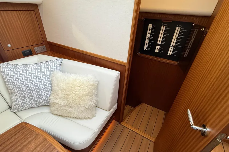 Slide: The Image of Luxurious interior of 2021 Elling E6 yacht with plush seating and control panel. - 37