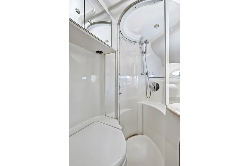 Slide: The Image of 2003 Sea Ray 450 Express Bridge yacht bathroom with modern shower and sleek design. - 68